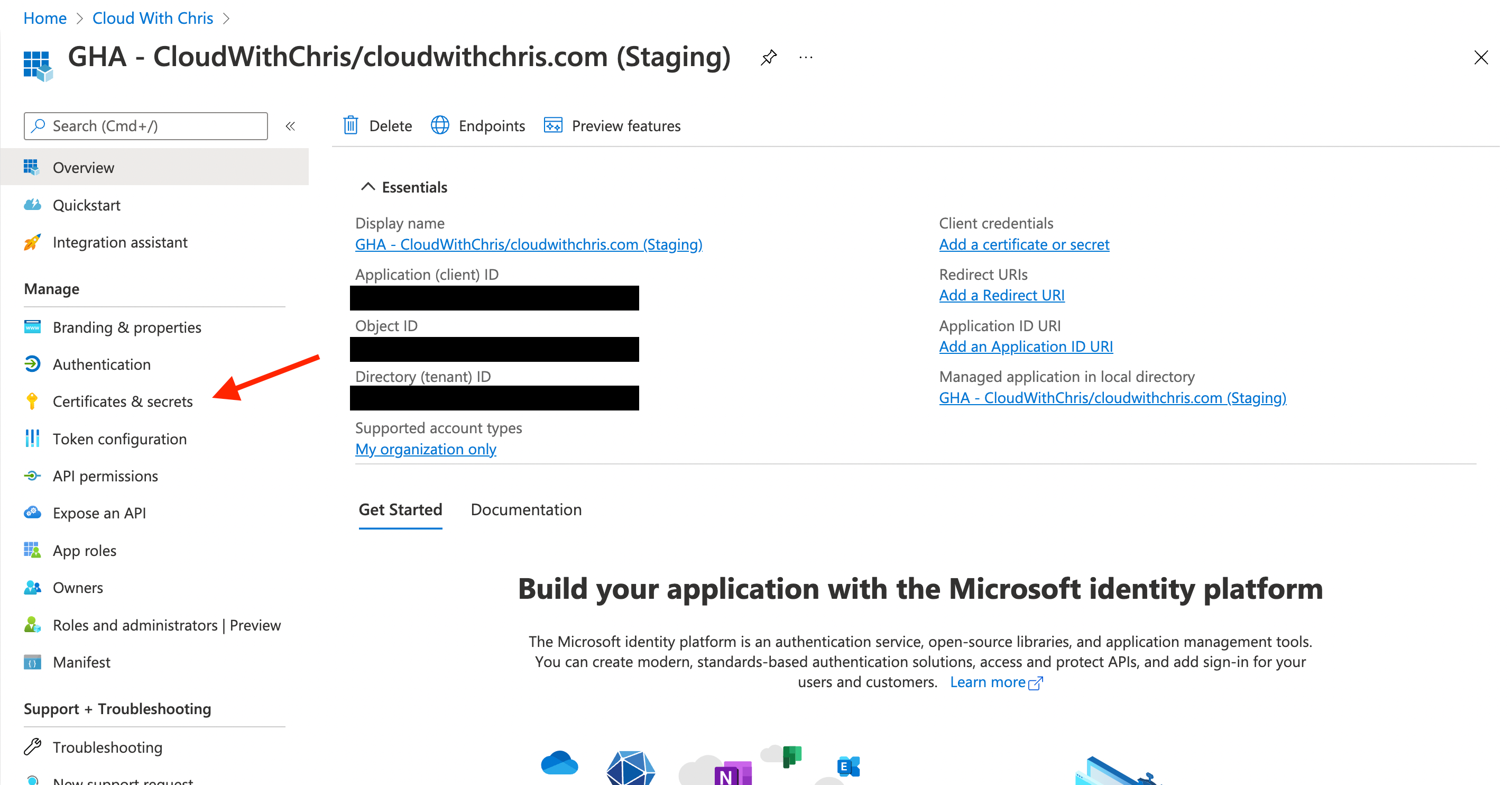 Screenshot showing that the App Registration 'GHA - CloudWithChris/cloudwithchris.com (Staging)' was successfully created. An arrow is pointing to the 'Certificates & Secrets' menu item for the next step.